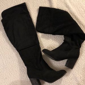 Thigh high, black, 3 inch heeled boots.